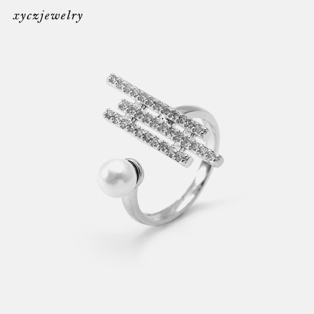 Anel satélite cravejado com pérola shell no atacado