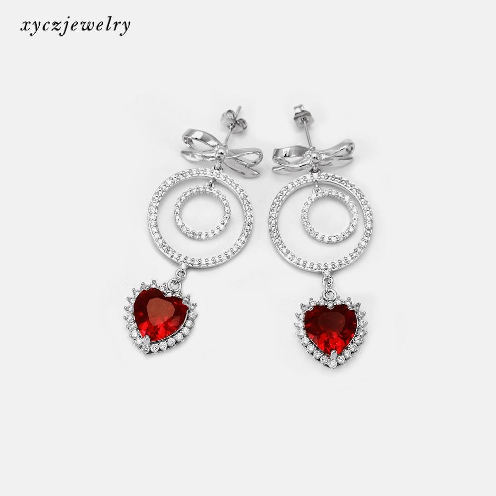 DESC-Brinco Laço e Coração XYE103853