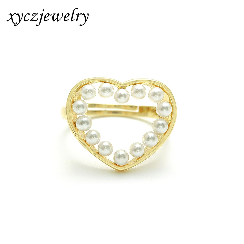 Anel de coração vazado com pérolas no atacado