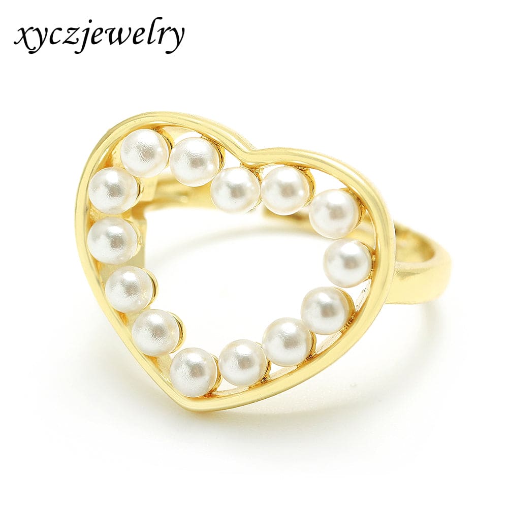 Anel de coração vazado com pérolas no atacado