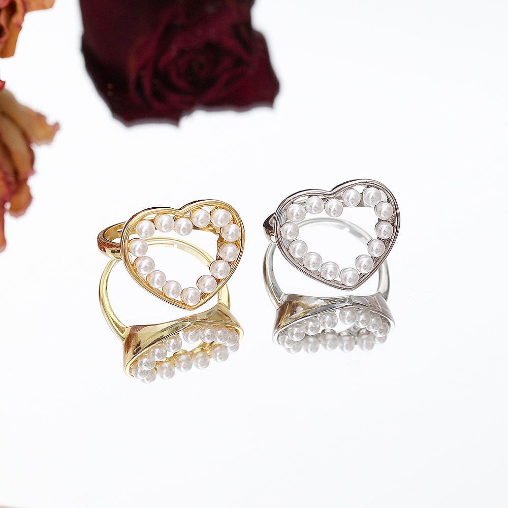 Anel de coração vazado com pérolas no atacado