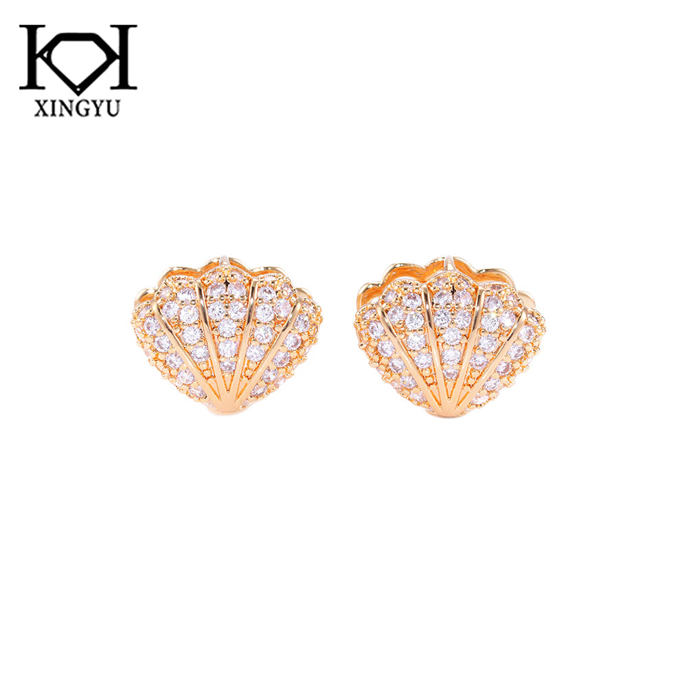 Brincos conchas cravejadas DCG0870