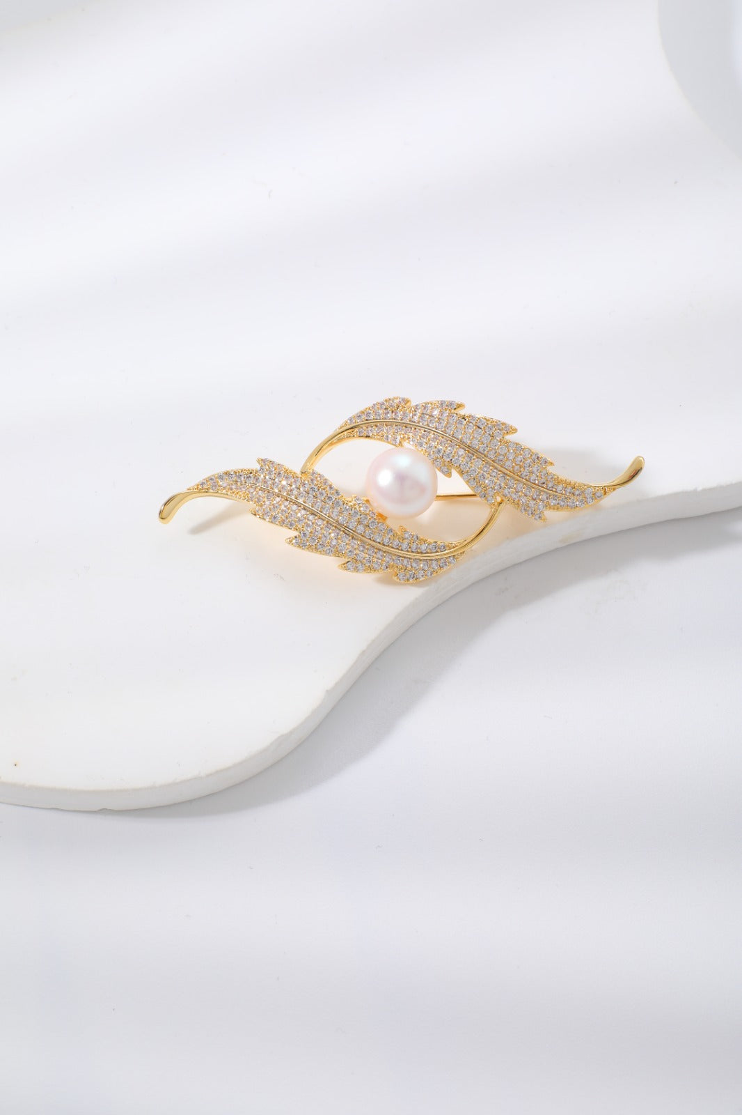 Broche movimento e luxo EBG0001